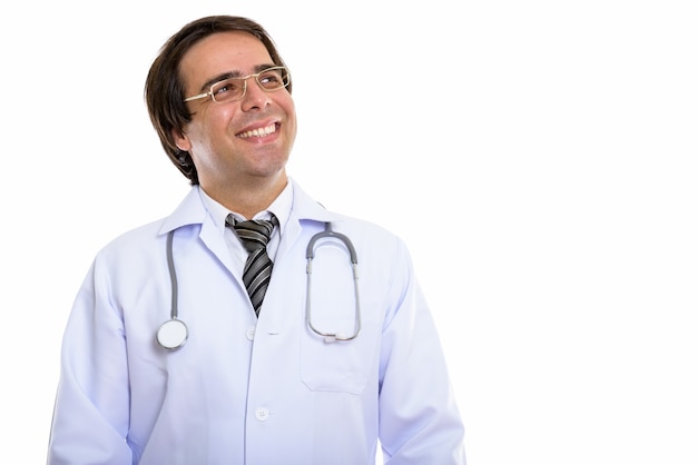 young happy Persian man doctor smiling while looks up