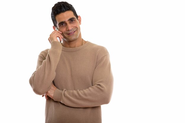 young happy Persian man smiling while talking