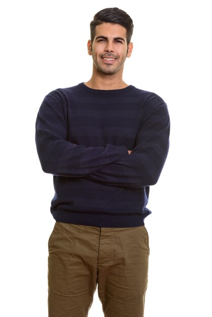 Young happy Persian man smiling with arms crossed