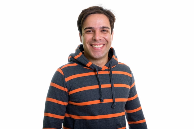 young happy Persian man smiling with hoodie