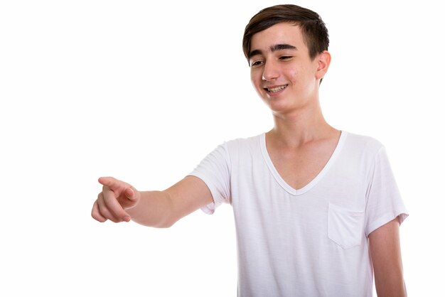 young happy Persian teenage boy smiling and laughing