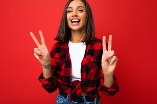 Young happy positive cool beautiful brunette woman with sincere emotions wearing white tshirt and