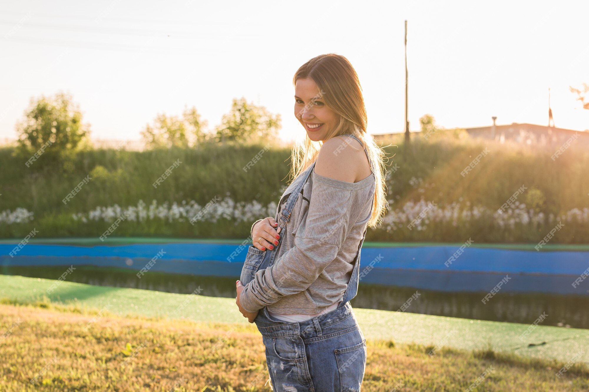 Happy Woman Enjoying Life in the Autumn on the Nature Stock Photo