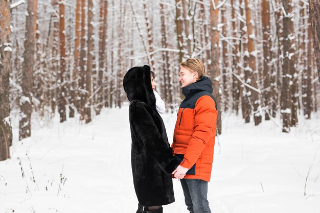 Young happy smiling couple in love. Winter.