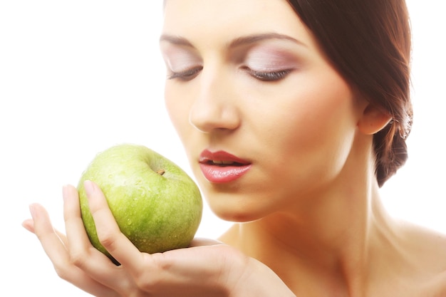 Young happy smiling woman with apple