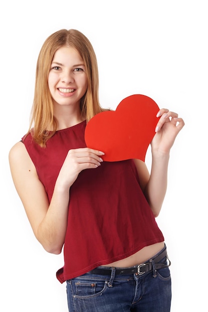 Young happy smiling woman with heart symbol, isolated.