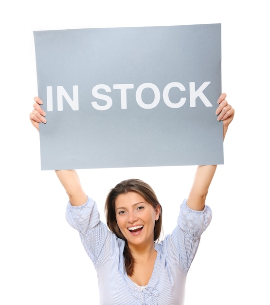 a young happy woman holding a banner over white background