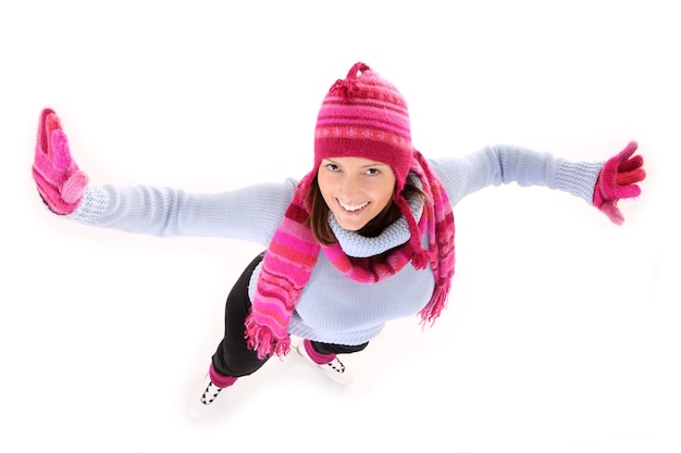 a young happy woman skating over white