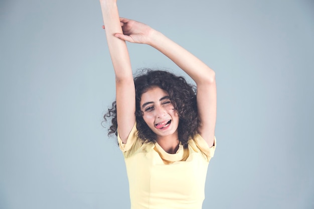 Young happy woman in studio