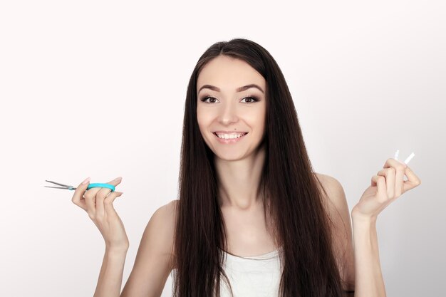 Young happy woman with broken cigarette Stop smoking concept