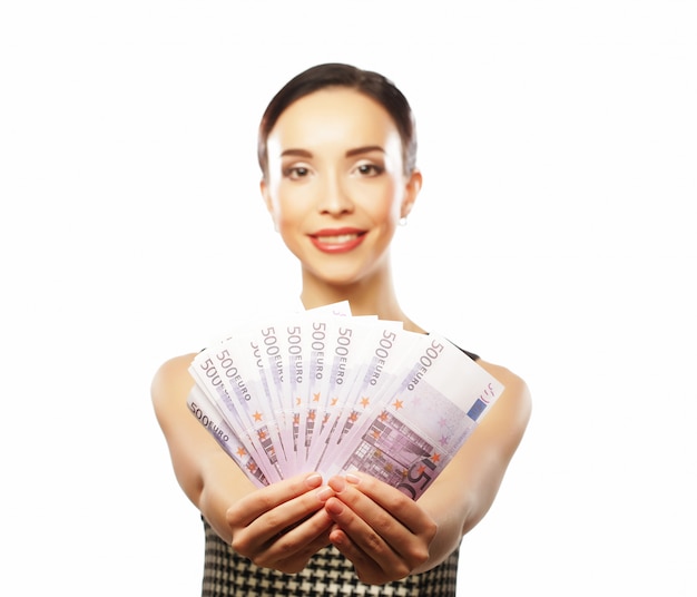 Young happy woman with dollars in hand