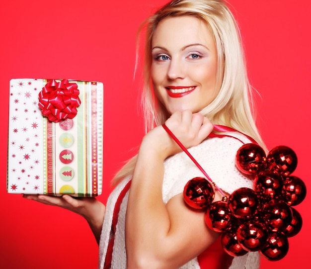 Young happy woman with a gift