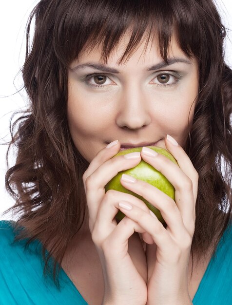 Young happy woman with green apple