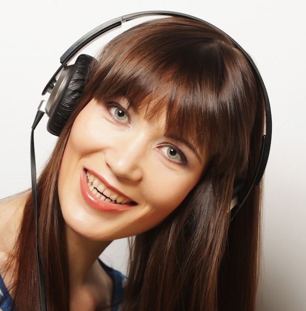 Young happy woman with headphones