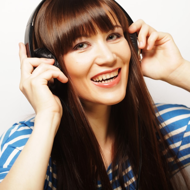 Young happy woman with headphones