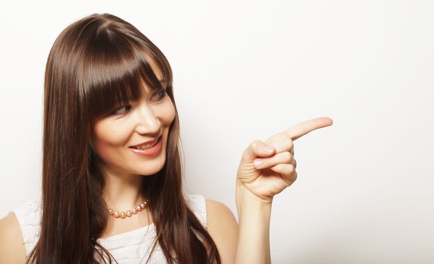 Young happy woman with her finger up