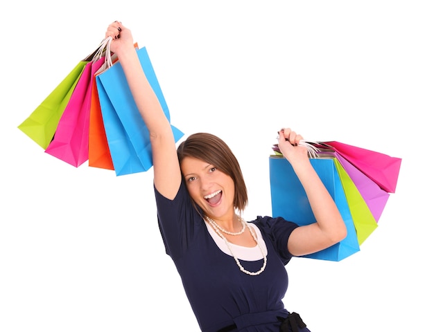 a young happy woman with shopping bags over white