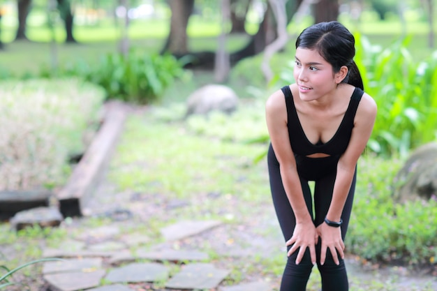 Young healthy and sporty woman do yoga stretching outdoor 