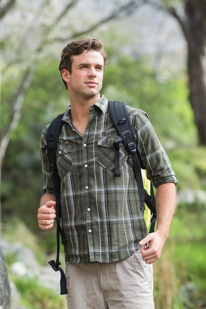 Young hiker looking away in forest