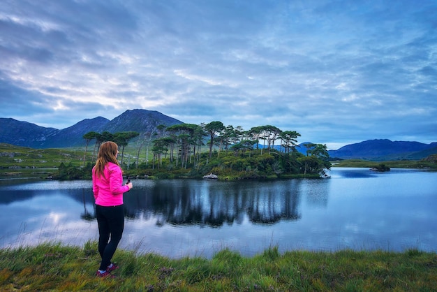 Young hiker at the pine island in derryclare lough