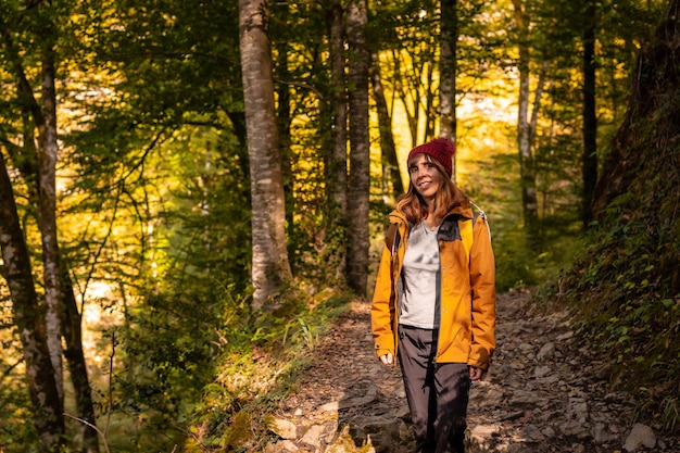 A young hiker on the trail to the Holtzarte suspension bridge, Larrau. In the forest or jungle of Irati, Pyrenees-Atlantiques of France