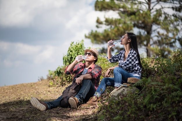 Young hiking drink water .adventure, travel, 