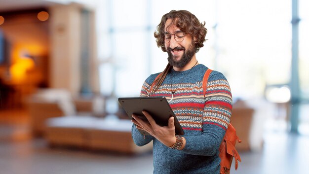 Young hippie man with a tablet