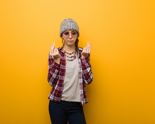 Young hippie natural woman doing a gesture of need