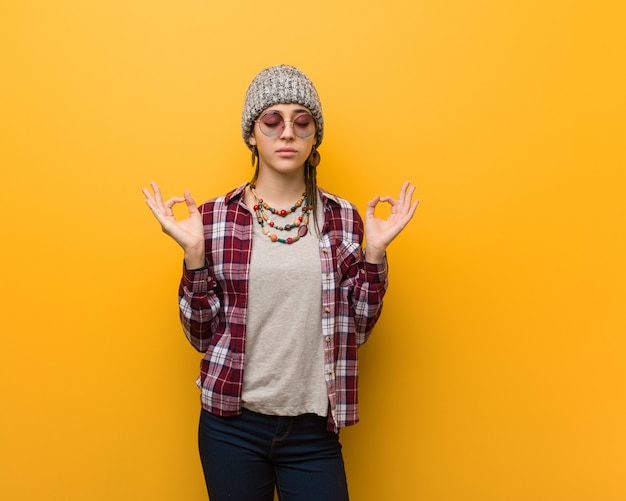 Young hippie natural woman performing yoga