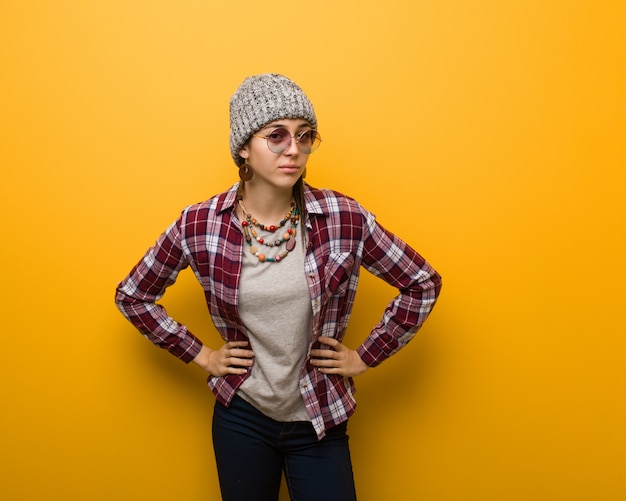 Young hippie natural woman scolding someone very angry