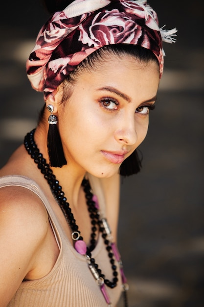 Young hippie style woman wearing handmade jewelry