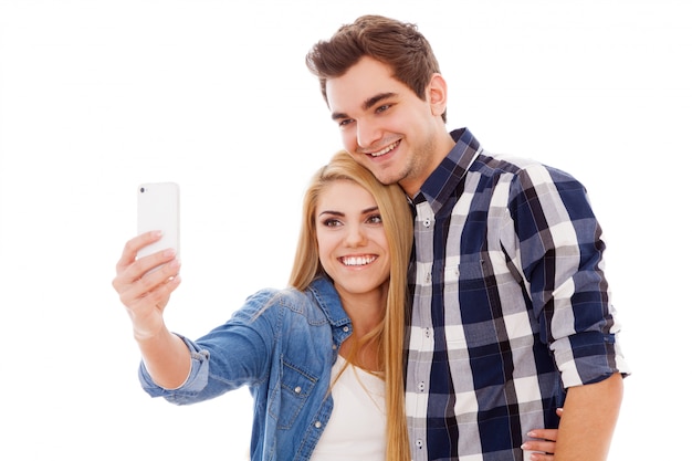 Young hipster couple making a selfie