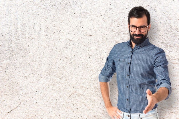 Young hipster man making a deal