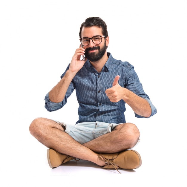 Young hipster man talking to mobile