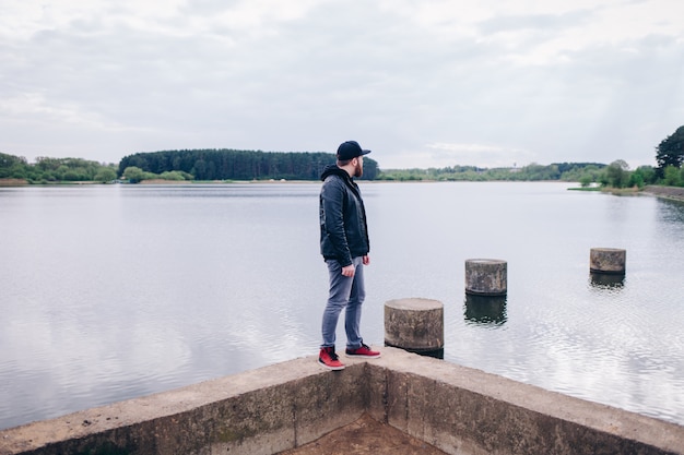 Young hipster man traveler hiking