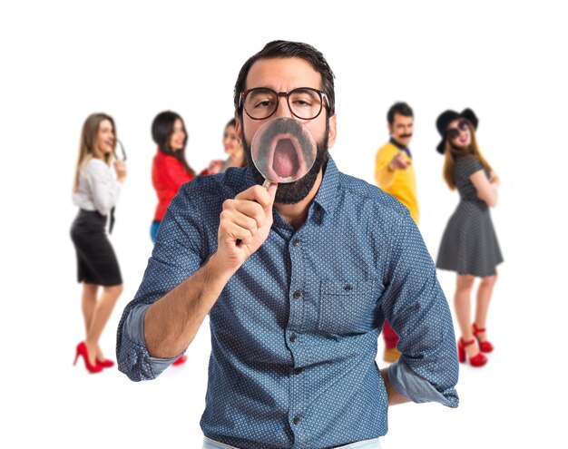 Photo young hipster man with magnifying glass