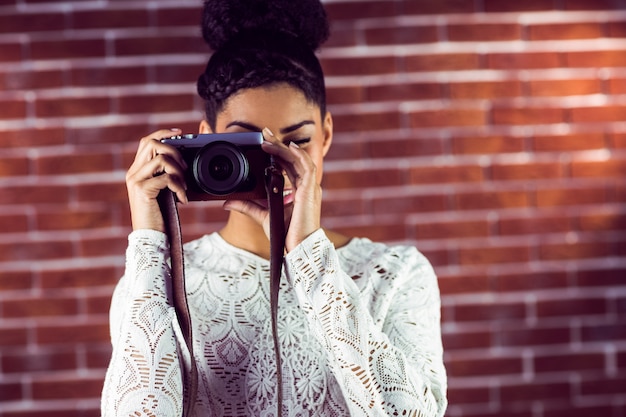 Young hipster taking a picture 