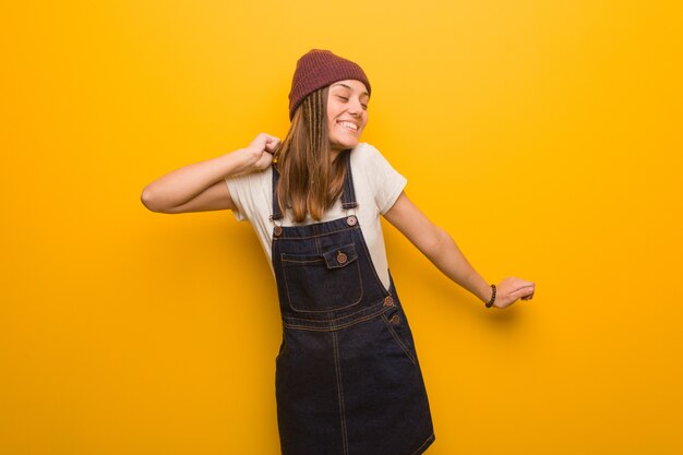 Young hipster woman dancing and having fun