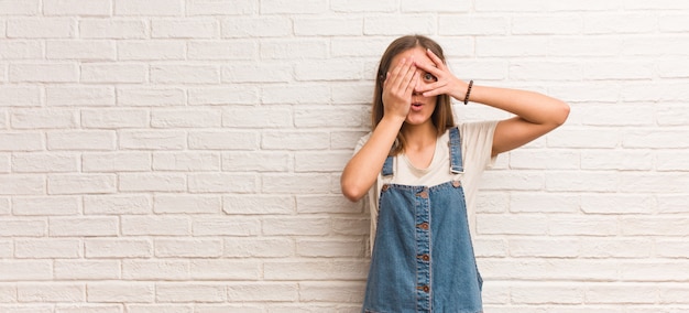 Young hipster woman feels worried and scared