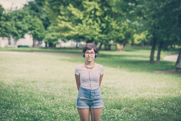 young hipster woman listening to music