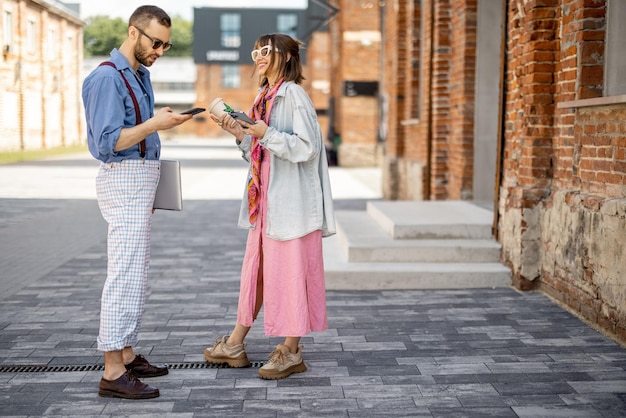 Young hipsters hang out together near office outdoors