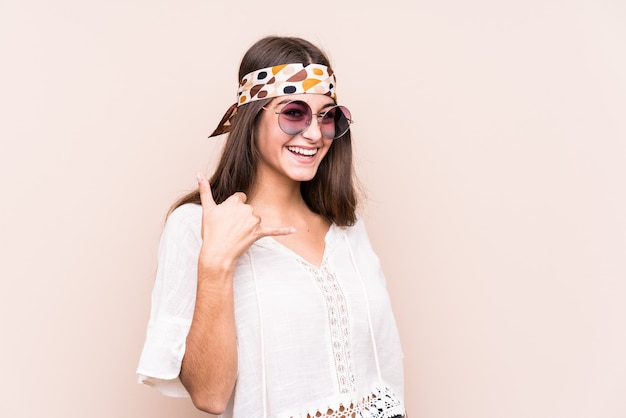 Young hipter caucasian woman isolated showing a mobile phone call gesture with fingers.