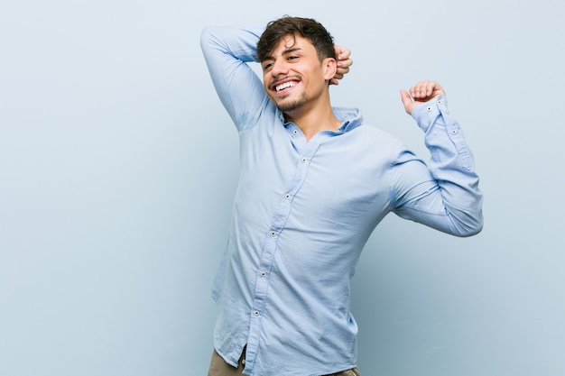 Young hispanic business man stretching arms