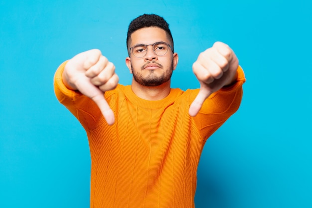 Young hispanic man angry expression