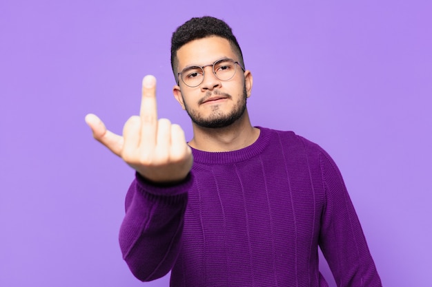 Young hispanic man angry expression