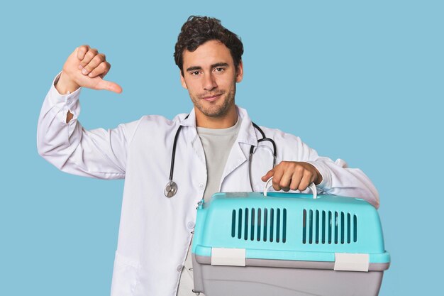 Young Hispanic man as vet with cage feels proud and self confident example to follow