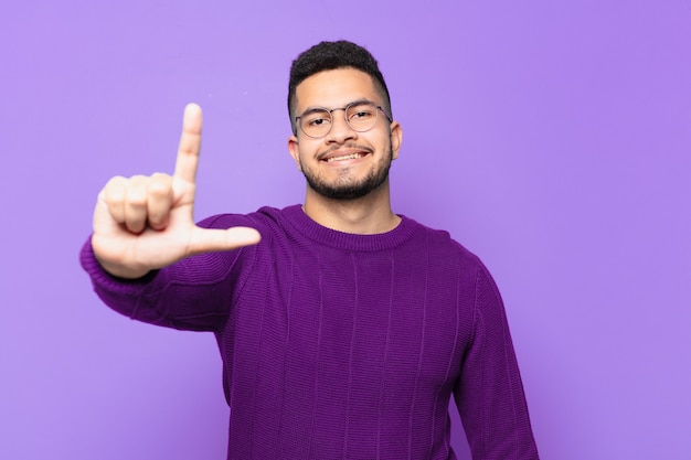 Young hispanic man happy expression