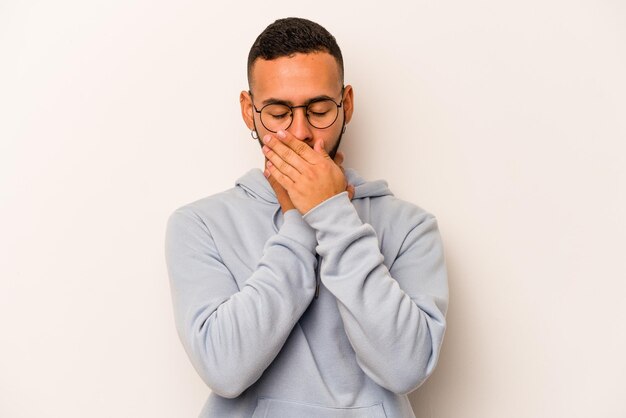 Young hispanic man isolated on white background suffers pain in throat due a virus or infection