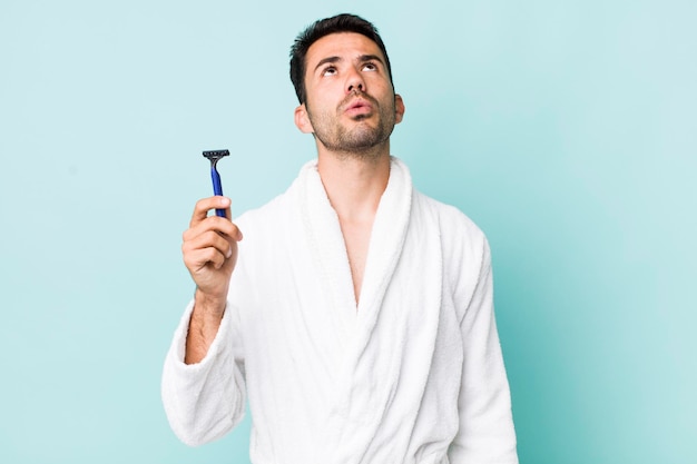 Young hispanic man shaving concept