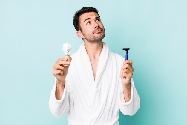 Young hispanic man shaving concept